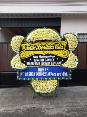 Papan Bunga Duka di Kayu Ara